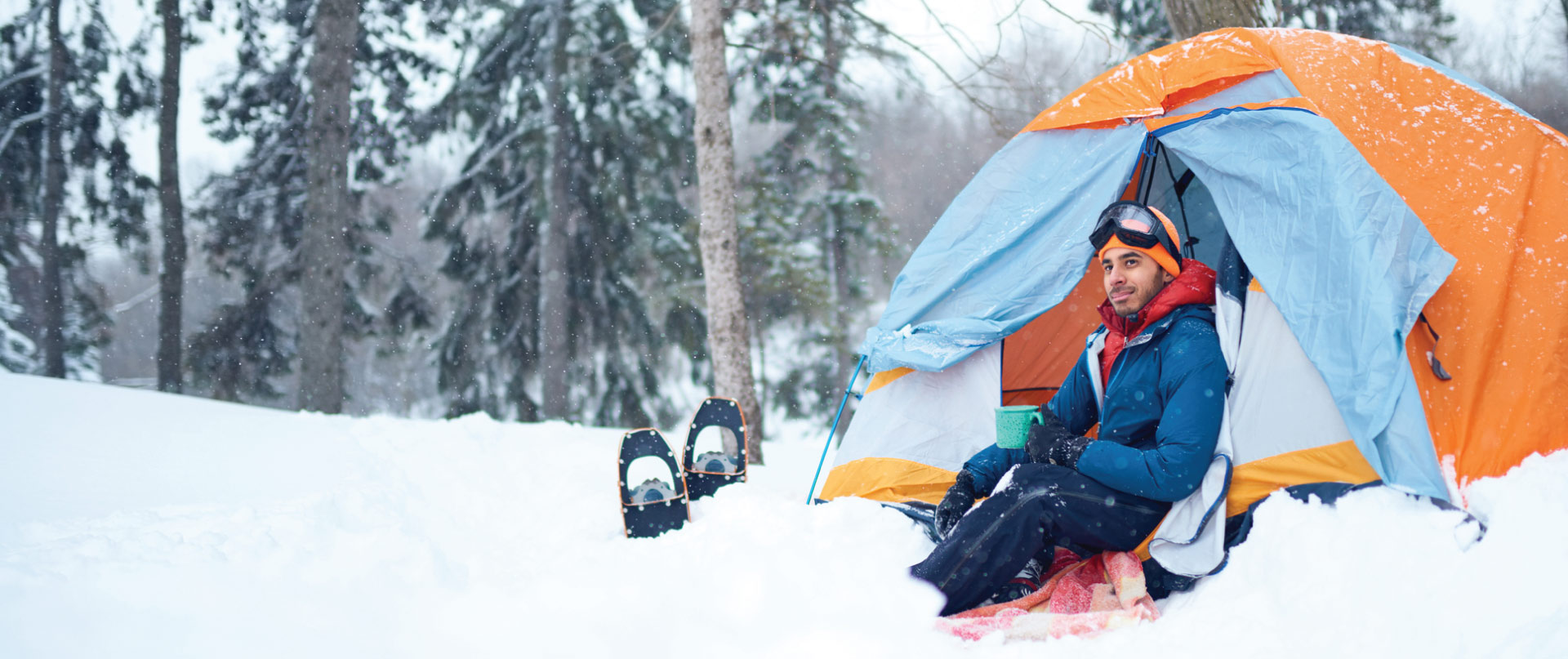 Man in tent on mountain