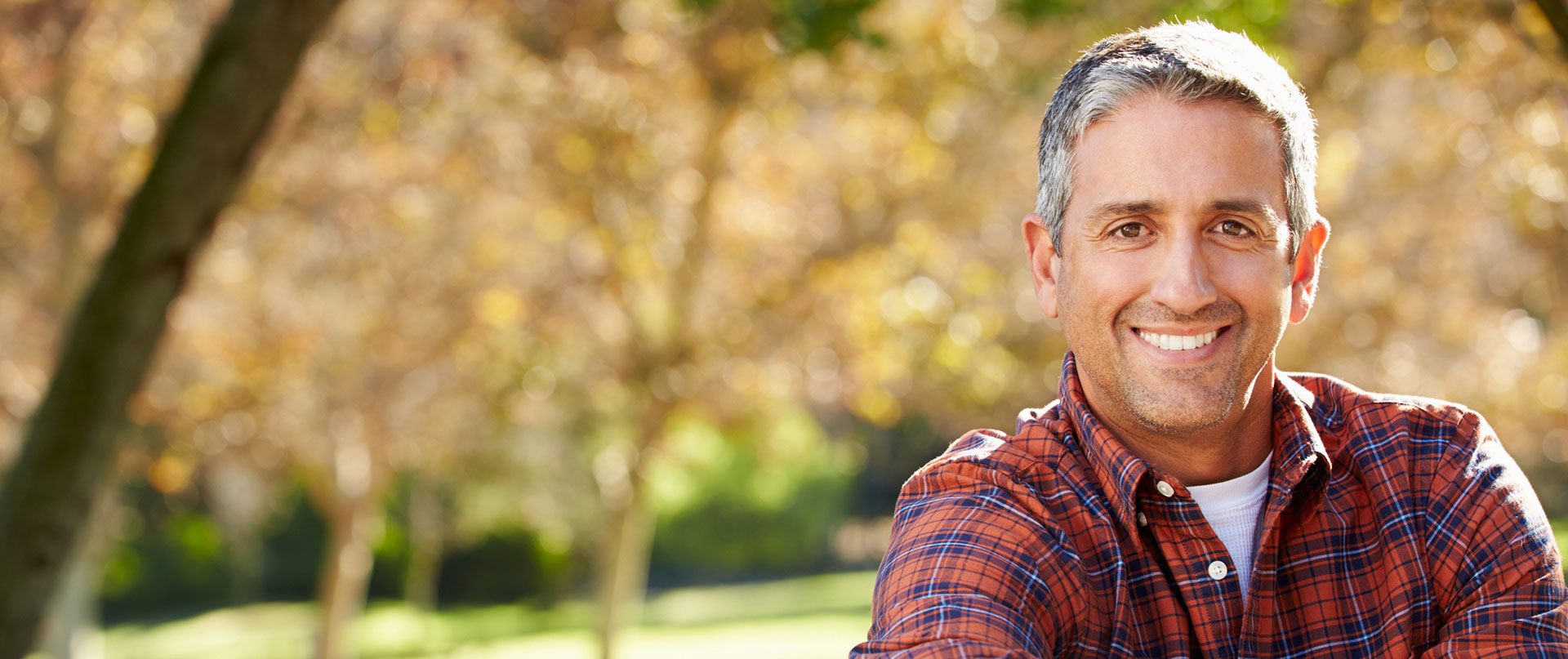 Man sitting outside in Autumn