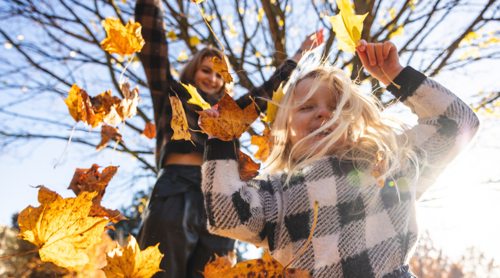 kids playing in leaves