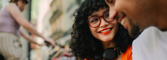 young woman in glasses smiling