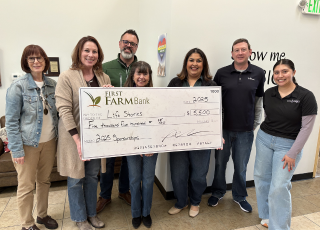 employees holding check