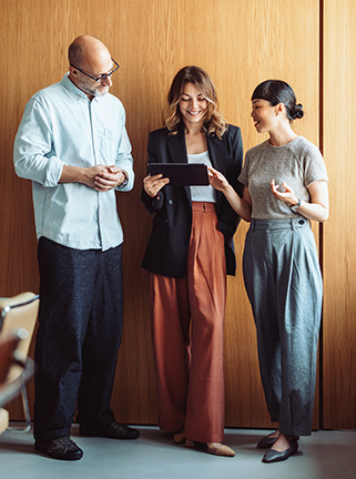 Group of coworkers looking at tablet