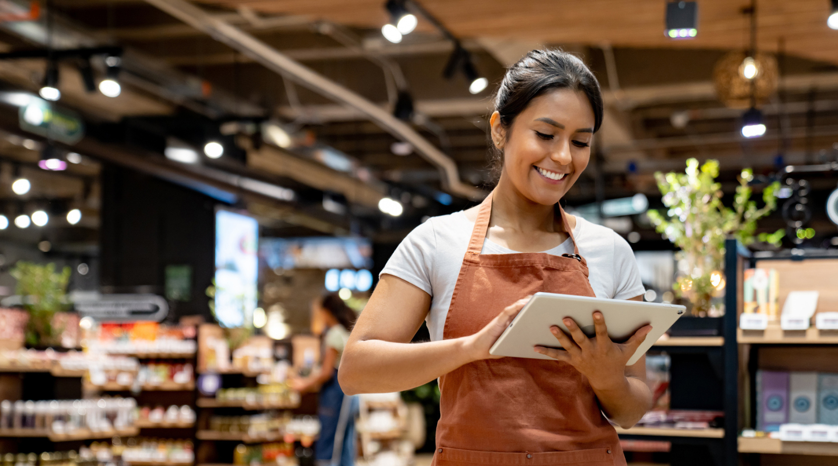 woman using tablet in shop